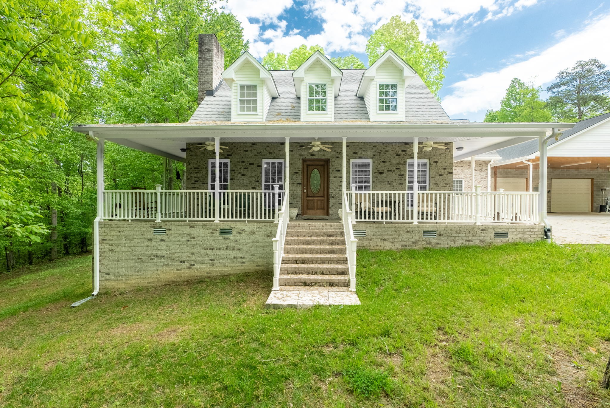 5298 Ridge Road Joelton, TN 37080 - Photo 2 of 46 a front view of a house with a garden