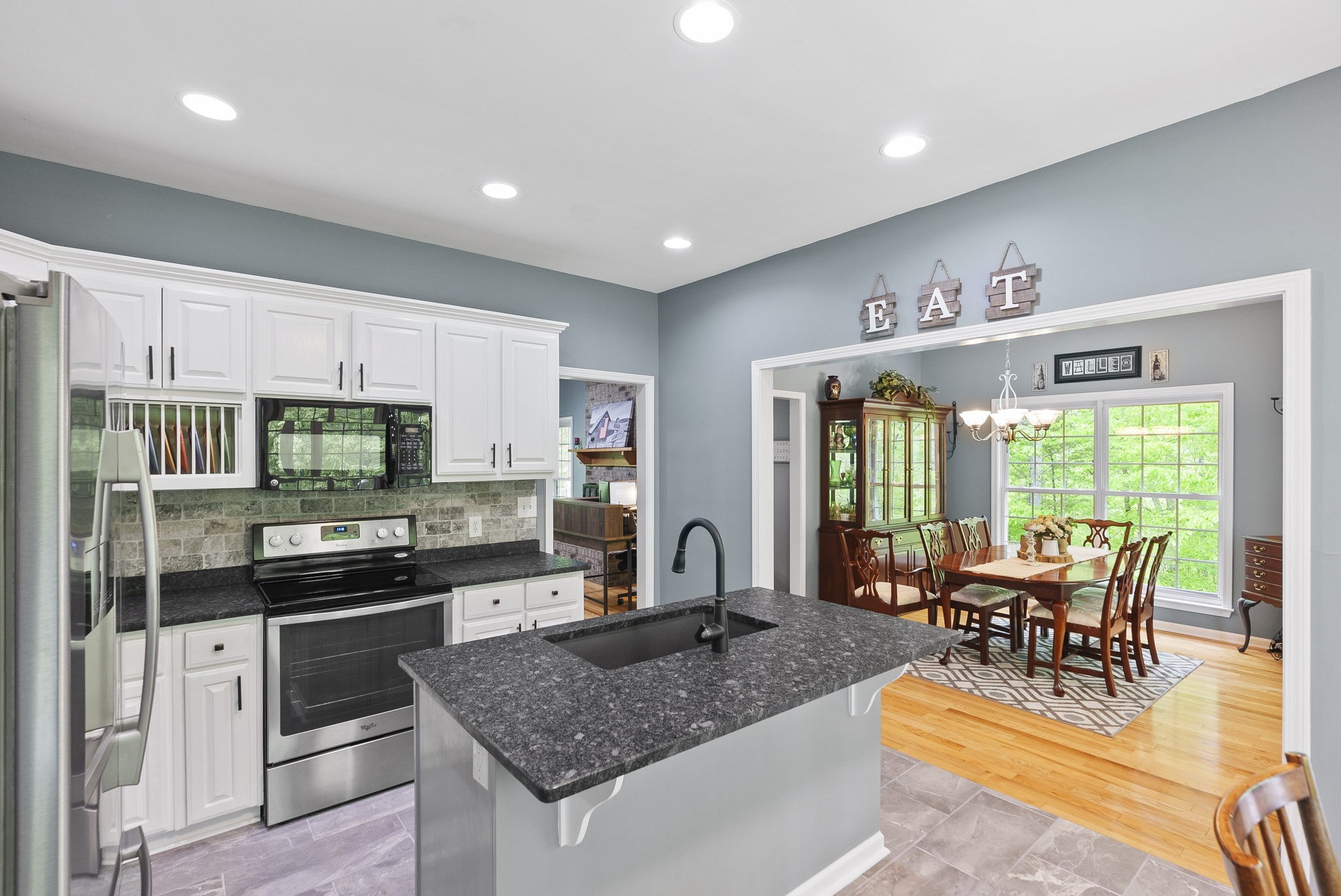 5298 Ridge Road Joelton, TN 37080 - Photo 22 of 46 a kitchen with stainless steel appliances granite countertop a stove and a sink