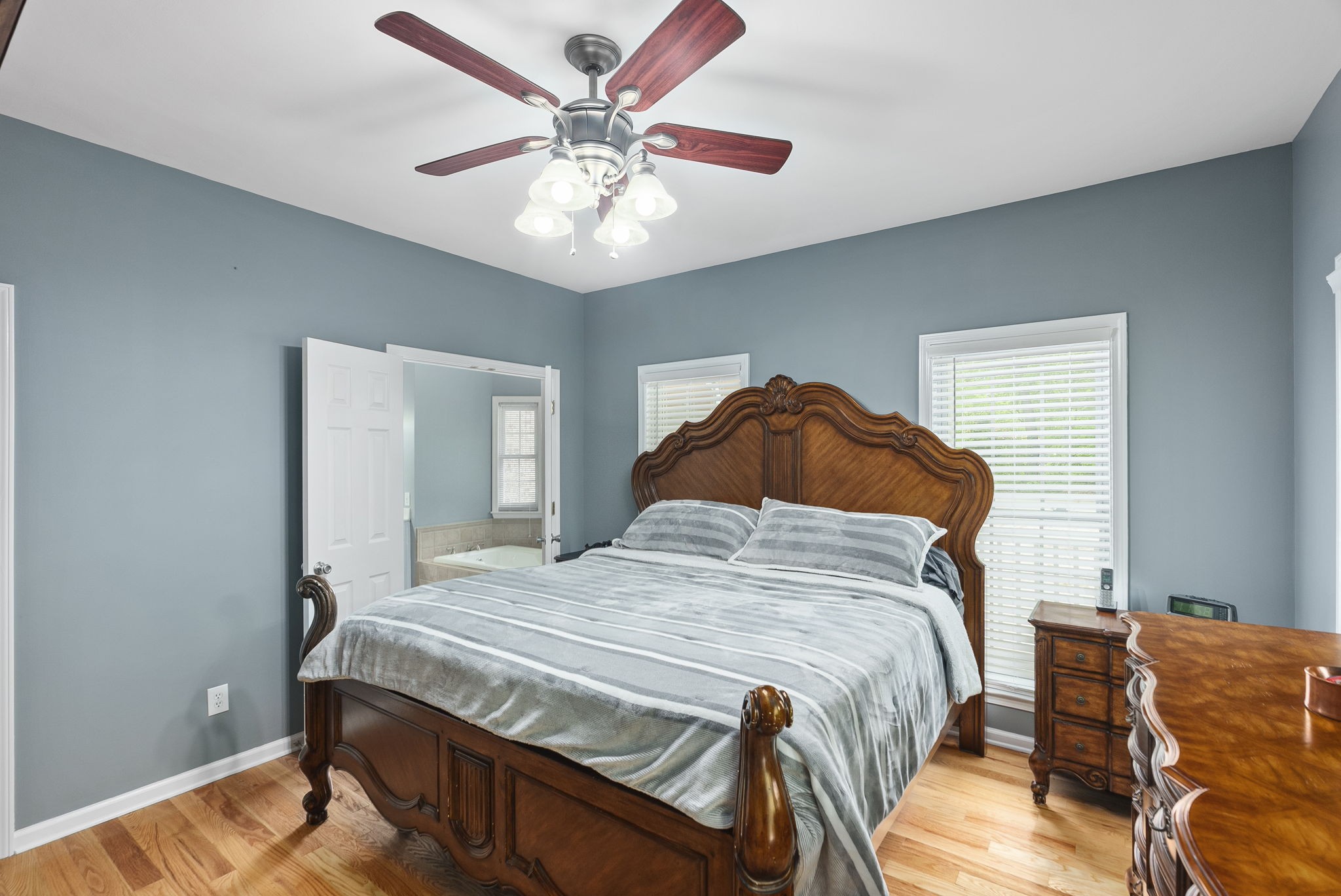 5298 Ridge Road Joelton, TN 37080 - Photo 31 of 46 a bedroom with a bed and a chandelier