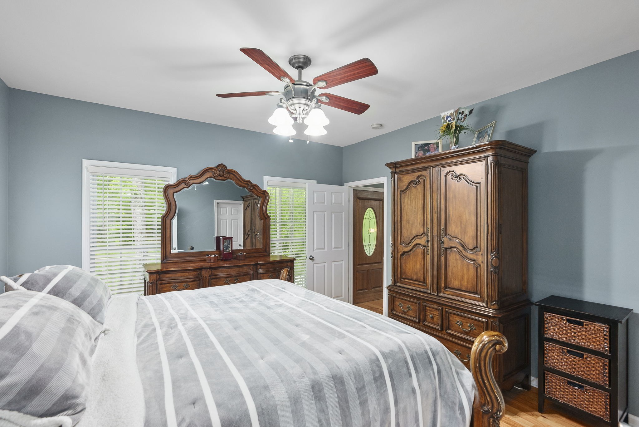 5298 Ridge Road Joelton, TN 37080 - Photo 32 of 46 a bedroom with a large bed and a chandelier