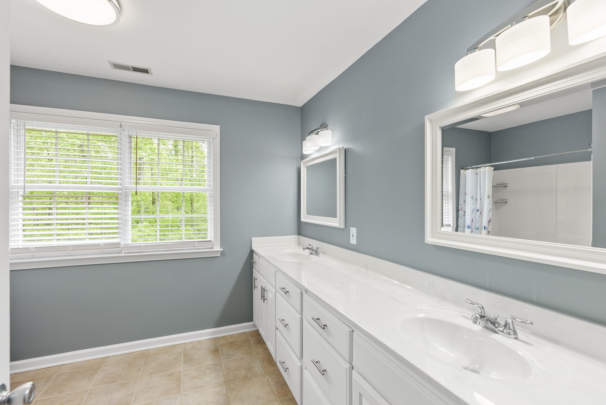 5298 Ridge Road Joelton, TN 37080 - Photo 36 of 46 a spacious bathroom with double vanity and a mirror