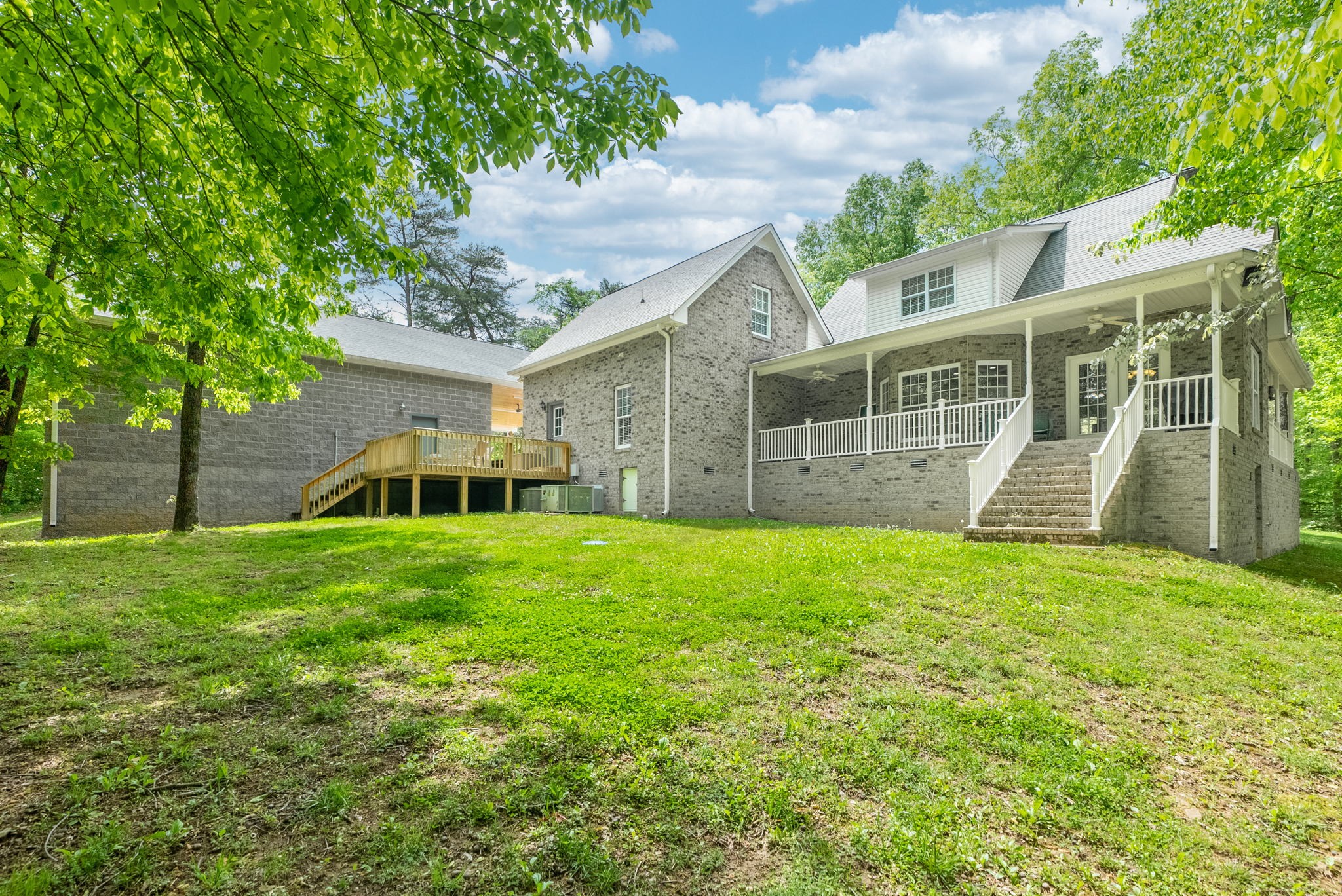 5298 Ridge Road Joelton, TN 37080 - Photo 40 of 46 a view of a yard in front of a house with plants and large tree