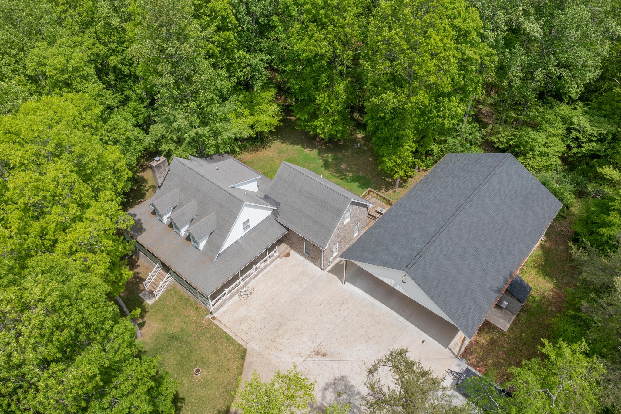 5298 Ridge Road Joelton, TN 37080 - Photo 8 of 46 an aerial view of a house with a yard and trees all around