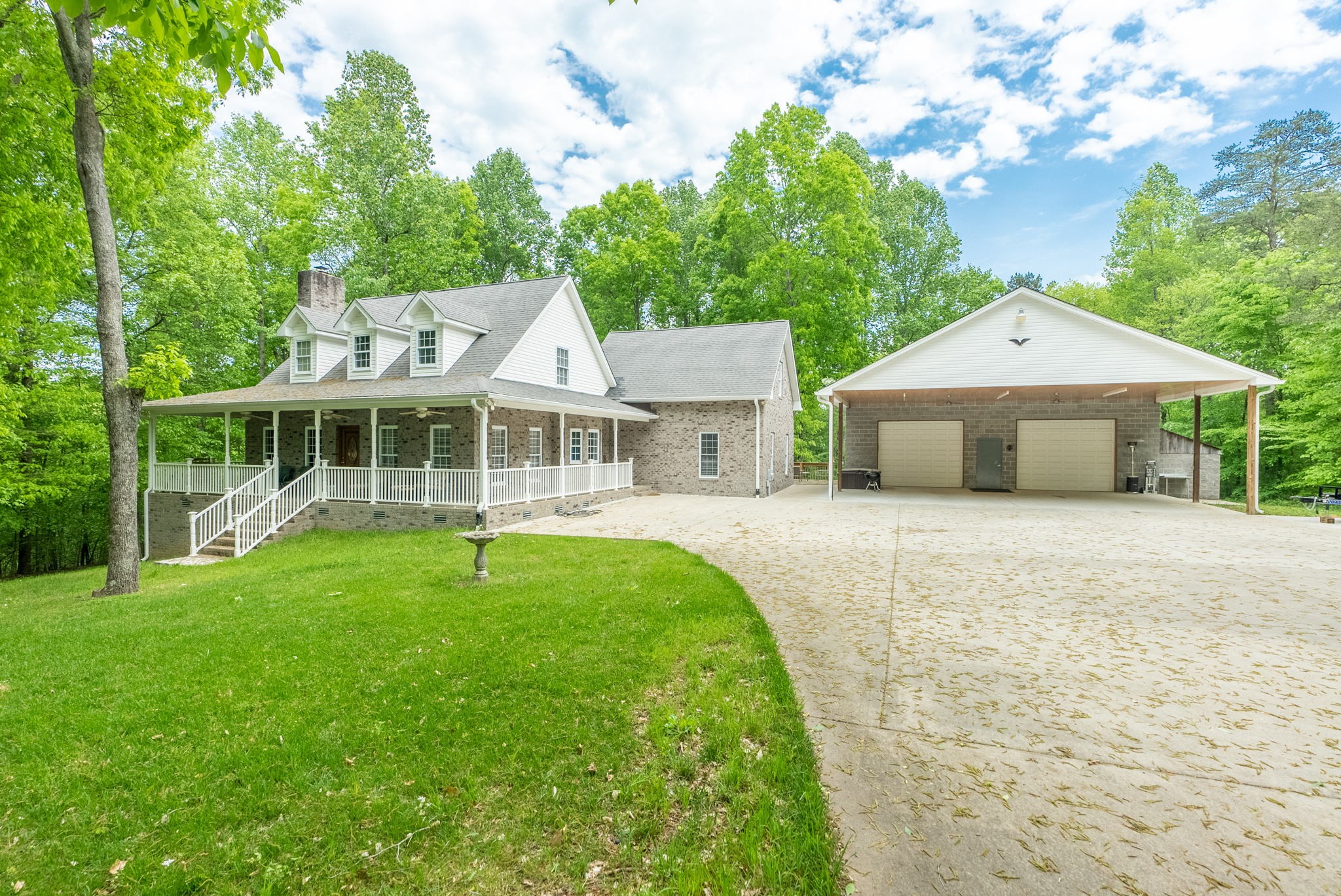 5298 Ridge Road Joelton, TN 37080 - Photo 9 of 46 a front view of a house with a yard and trees