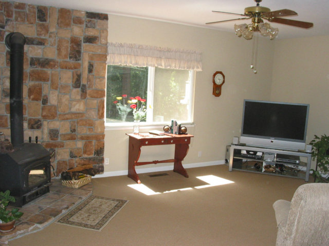 12533 Alba Road Ben Lomond, CA 95005 - Photo 6 of 12 a living room with furniture and a flat screen tv