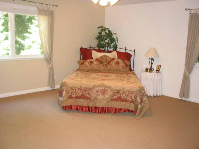 12533 Alba Road Ben Lomond, CA 95005 - Photo 8 of 12 a bed sitting in a bedroom next to a window