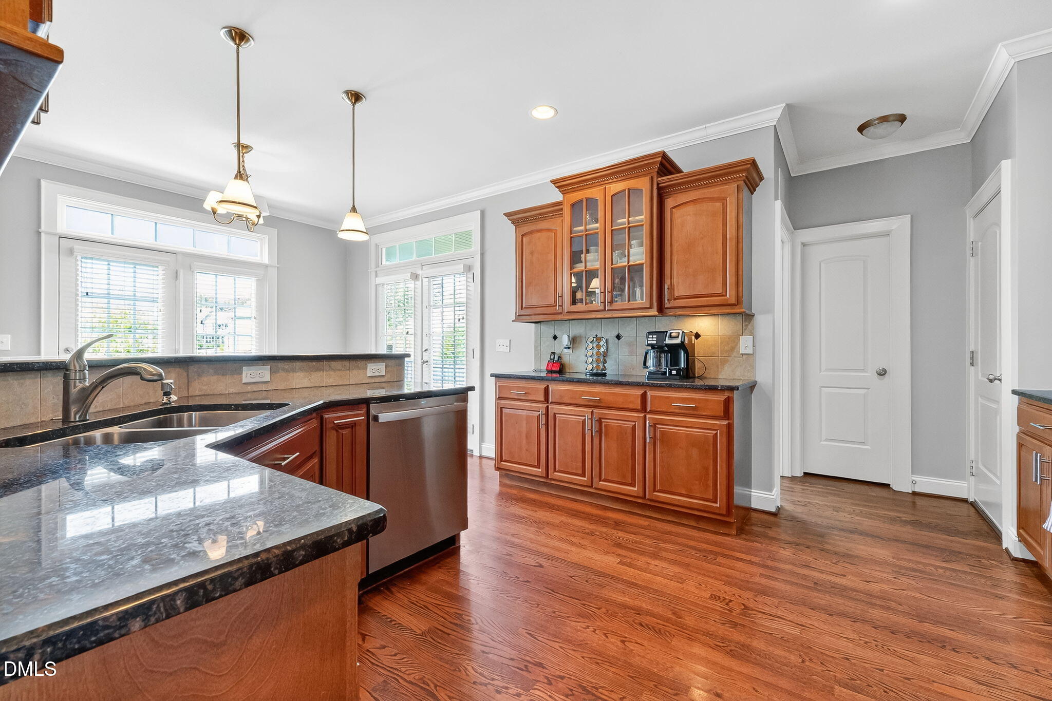 96 Jackson Ridge Court Willow Spring, NC 27592 - Photo 14 of 54 a kitchen with stainless steel appliances granite countertop wooden cabinets a stove a sink and a wooden floor
