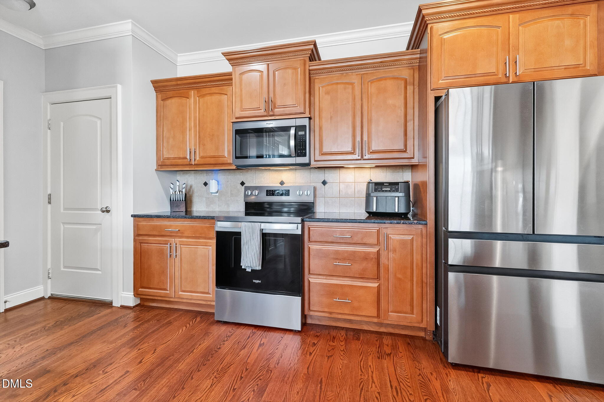 96 Jackson Ridge Court Willow Spring, NC 27592 - Photo 15 of 54 a kitchen with stainless steel appliances granite countertop a refrigerator microwave and sink