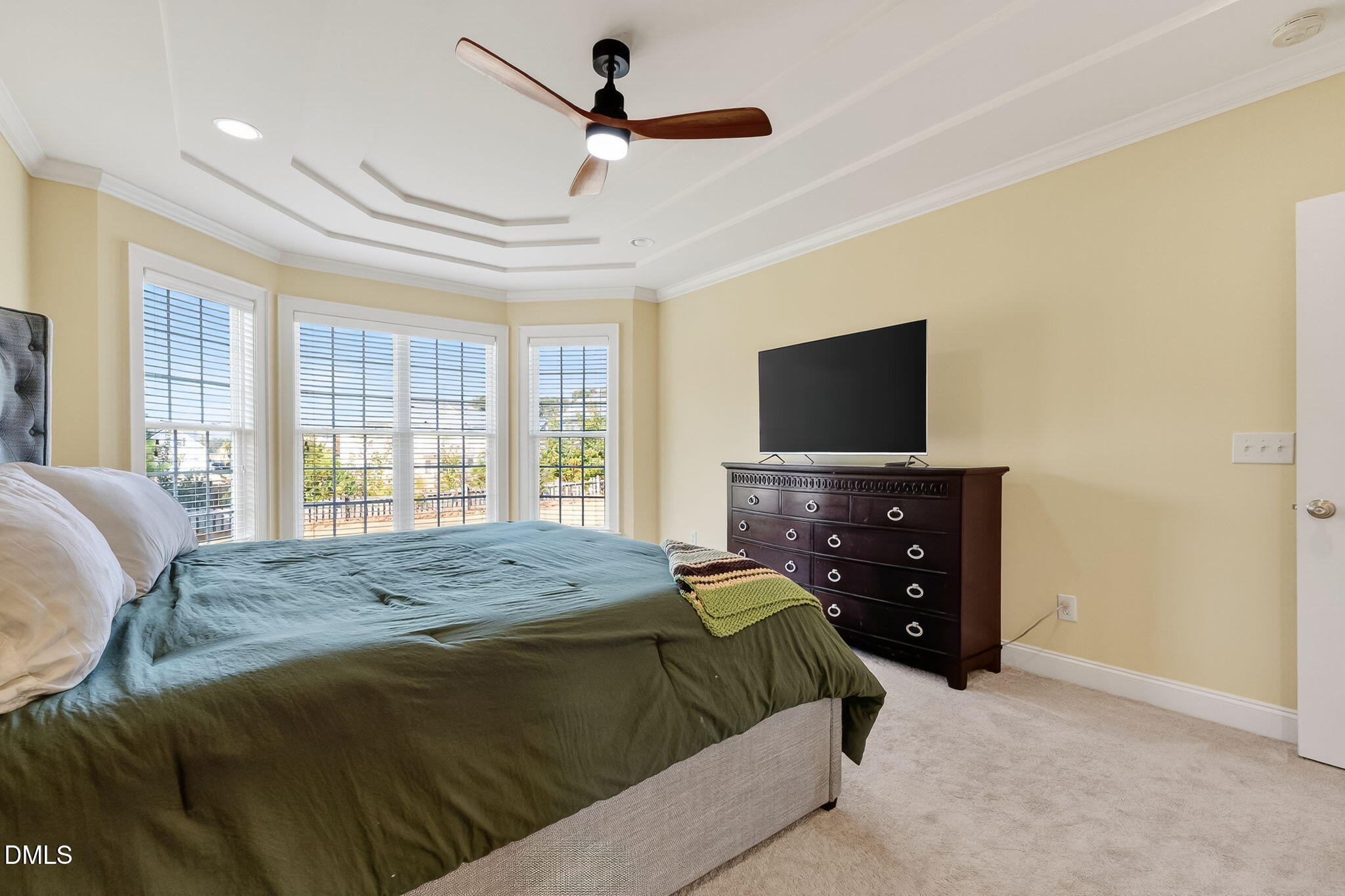 96 Jackson Ridge Court Willow Spring, NC 27592 - Photo 23 of 54 a bedroom with a bed and a flat screen tv