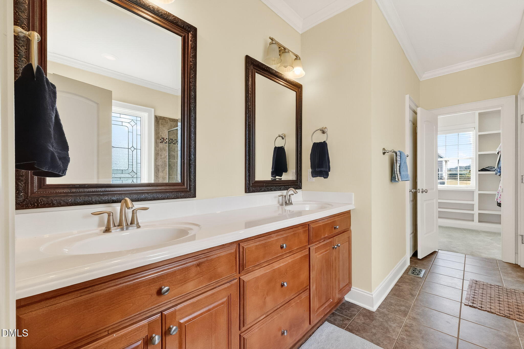 96 Jackson Ridge Court Willow Spring, NC 27592 - Photo 24 of 54 a bathroom with a double vanity sink and mirror