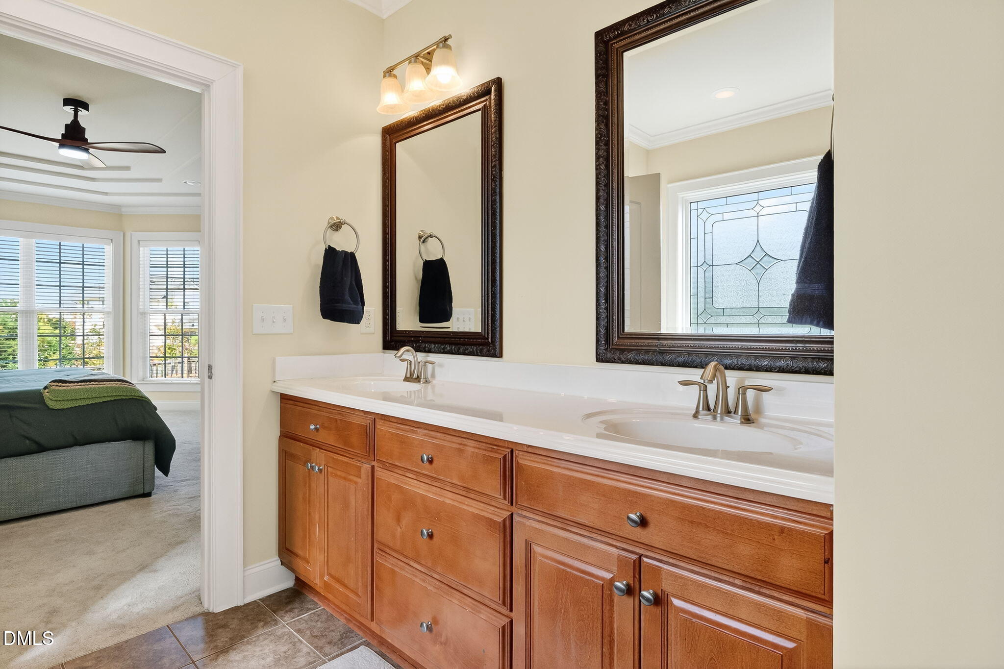 96 Jackson Ridge Court Willow Spring, NC 27592 - Photo 25 of 54 a en suite bathroom with double vanity and a mirror