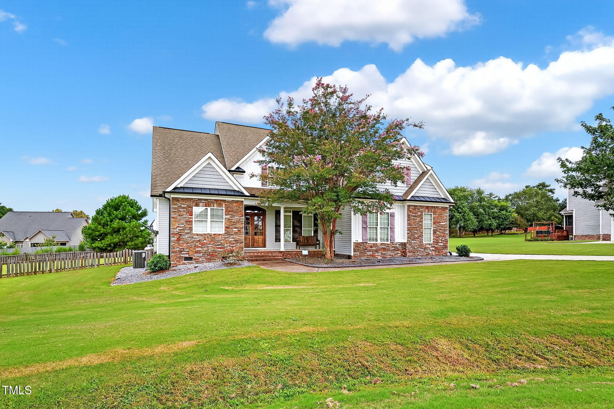 96 Jackson Ridge Court Willow Spring, NC 27592 - Photo 2 of 54 a front view of a house with garden and trees