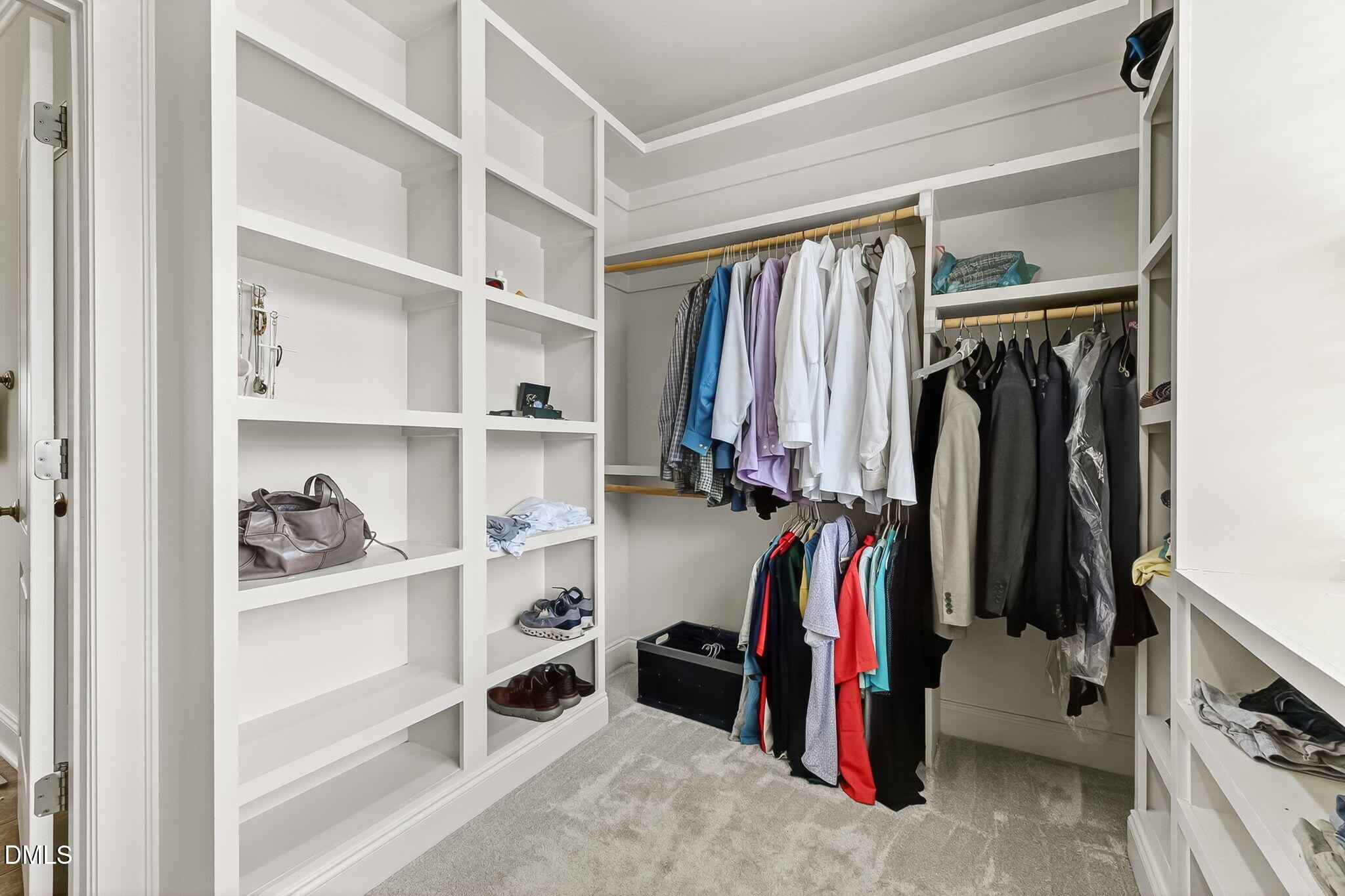 96 Jackson Ridge Court Willow Spring, NC 27592 - Photo 29 of 54 a view of walk in closet with clothes and shoes