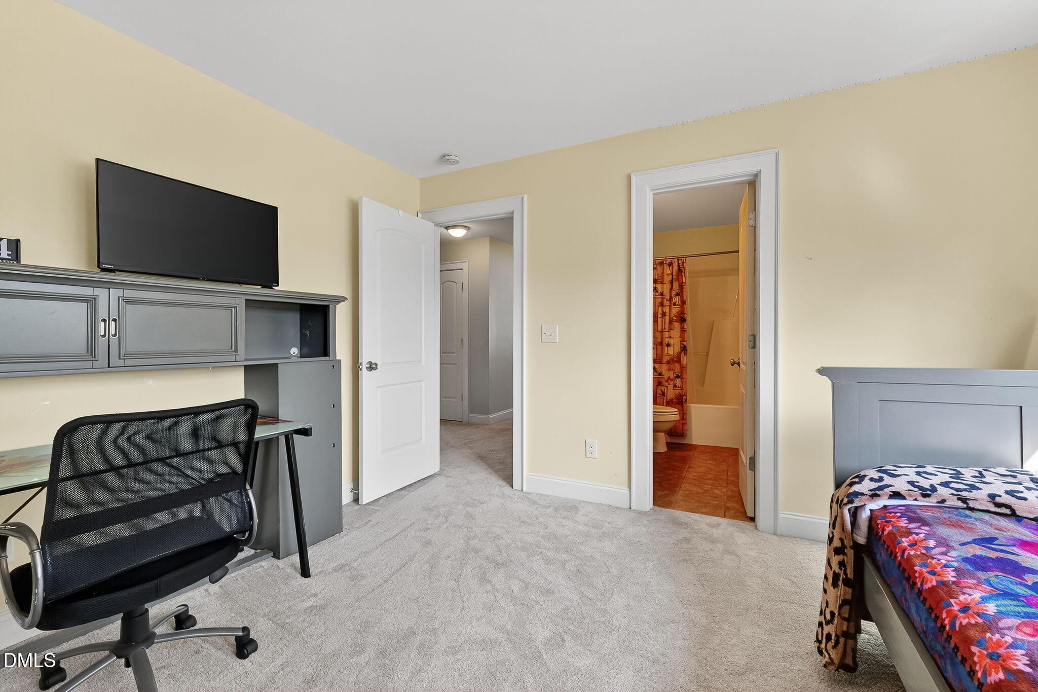 96 Jackson Ridge Court Willow Spring, NC 27592 - Photo 31 of 54 a bedroom with a bed and flat screen tv