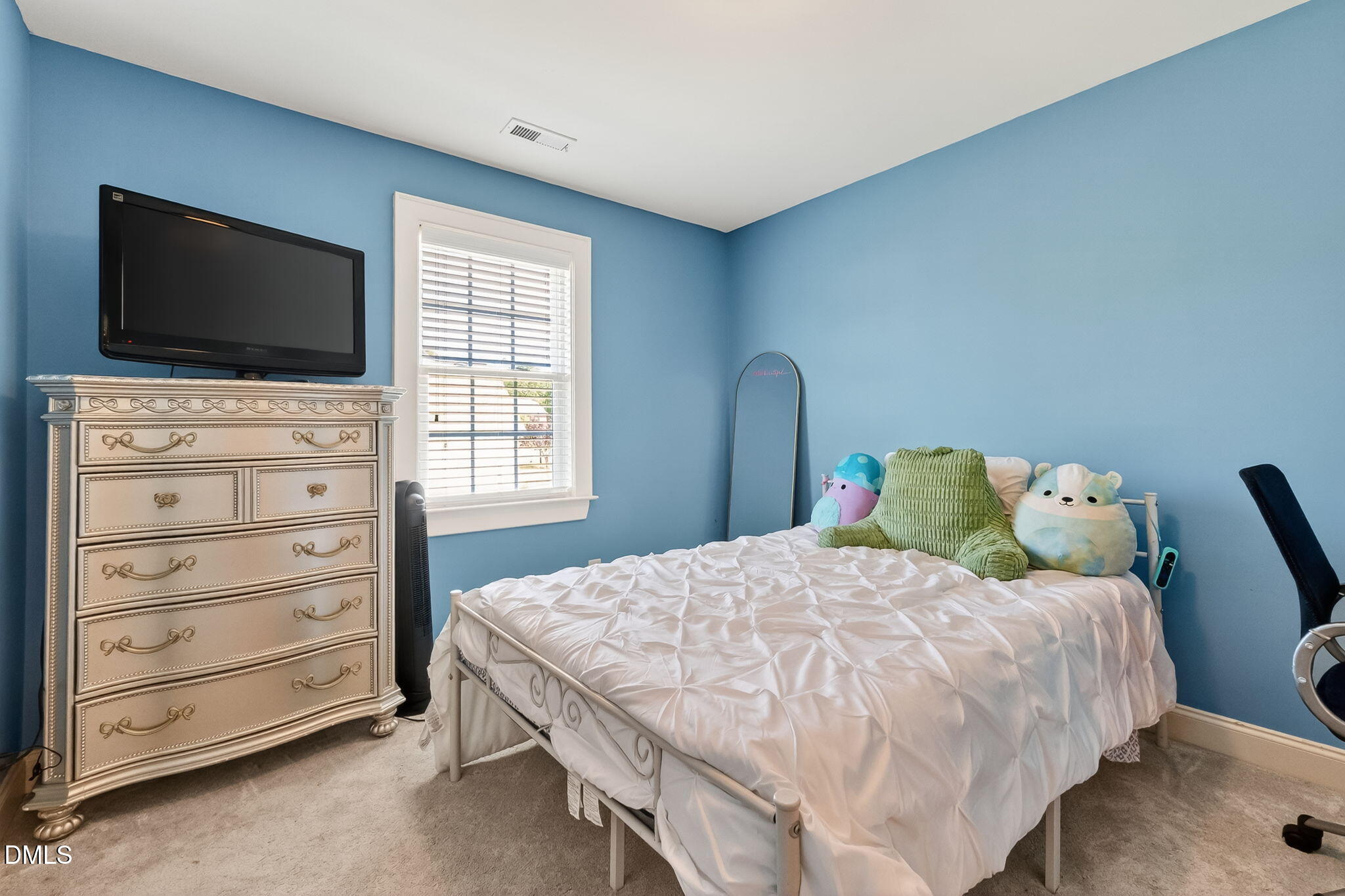96 Jackson Ridge Court Willow Spring, NC 27592 - Photo 37 of 54 a bedroom with a bed and flat screen tv