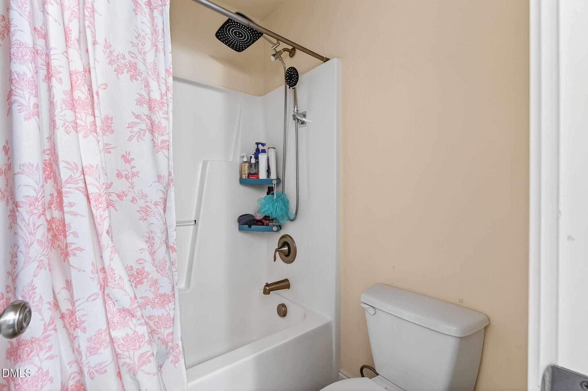 96 Jackson Ridge Court Willow Spring, NC 27592 - Photo 40 of 54 a bathroom with a toilet and a shower curtain