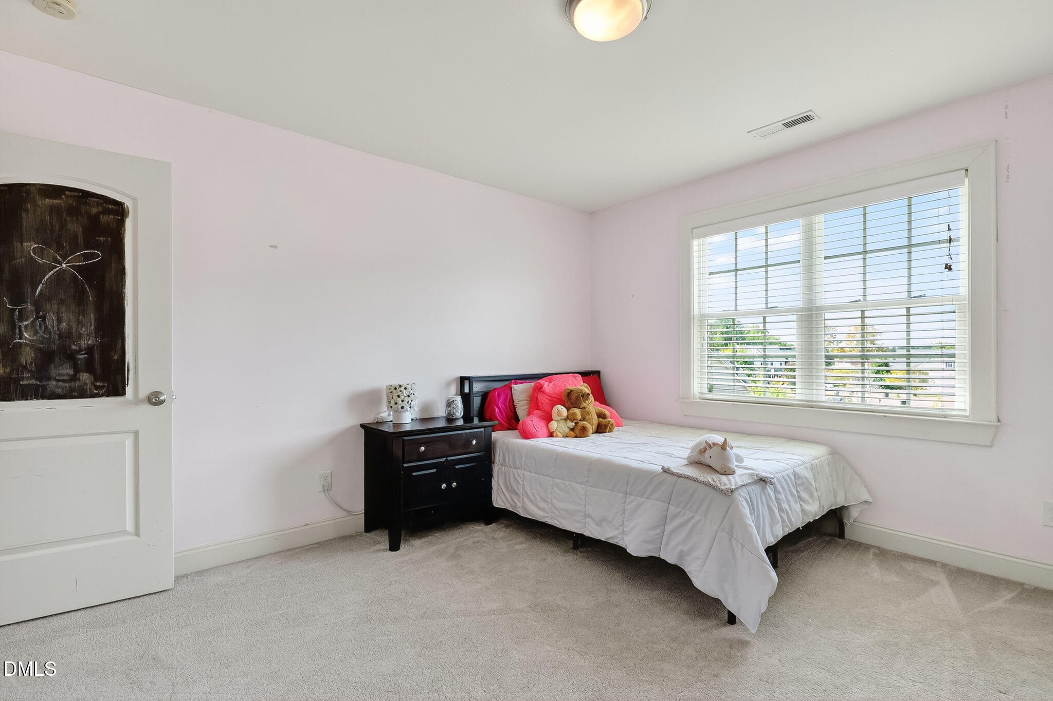 96 Jackson Ridge Court Willow Spring, NC 27592 - Photo 41 of 54 a living room with a bed furniture and a window