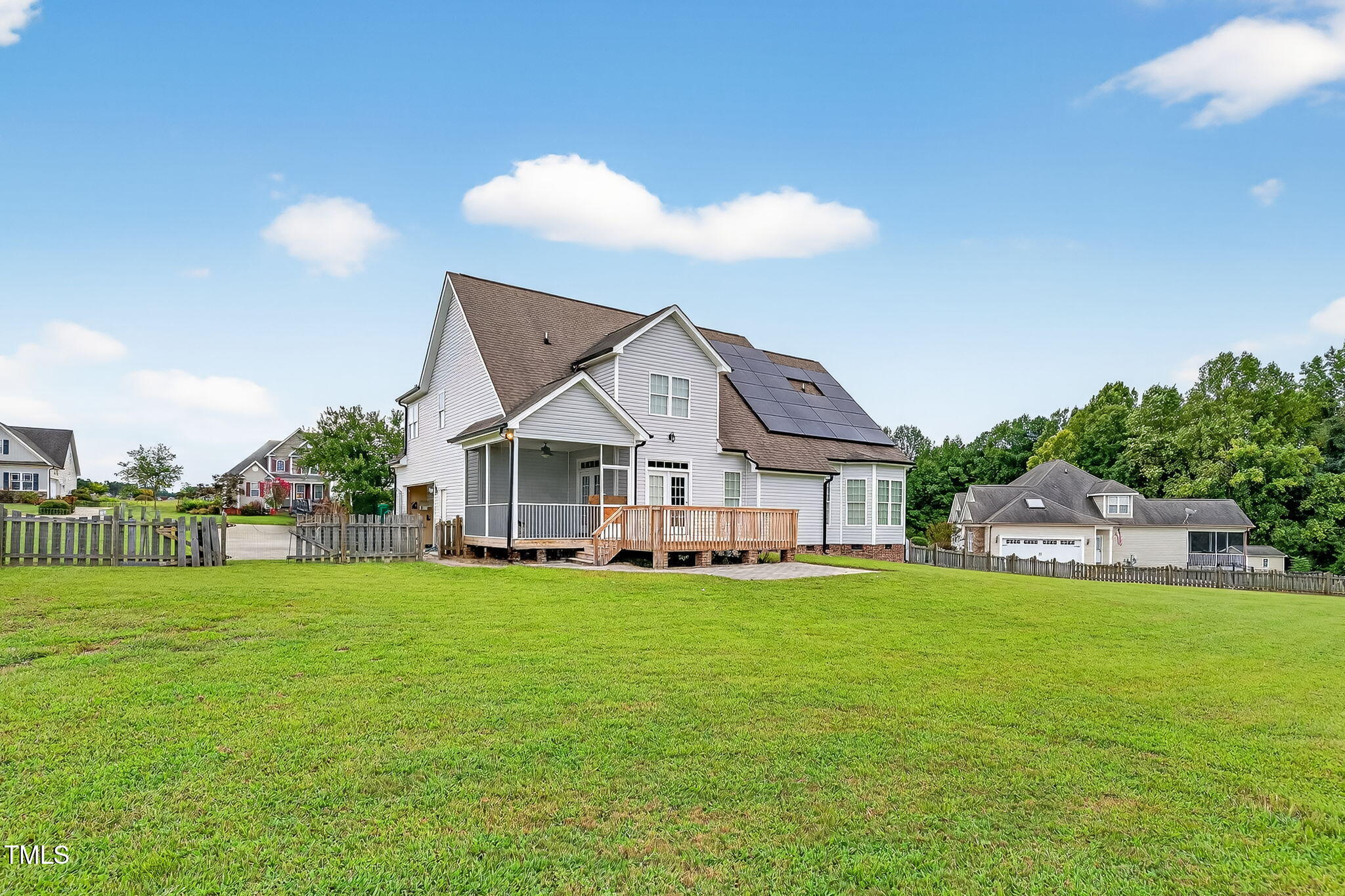 96 Jackson Ridge Court Willow Spring, NC 27592 - Photo 3 of 54 a view of a house with a big yard and a large tree