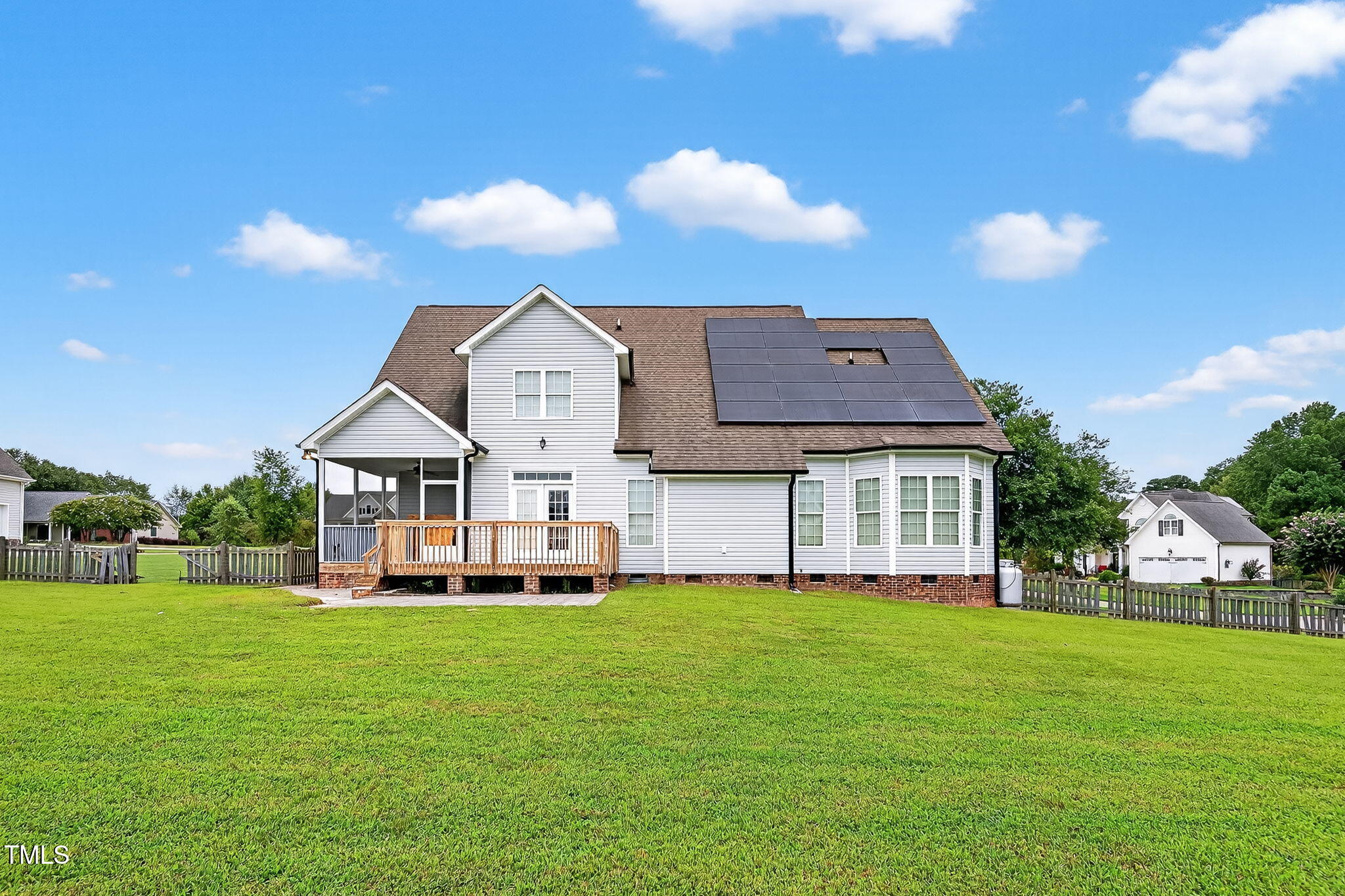 96 Jackson Ridge Court Willow Spring, NC 27592 - Photo 4 of 54 a front view of a house with a yard and trees