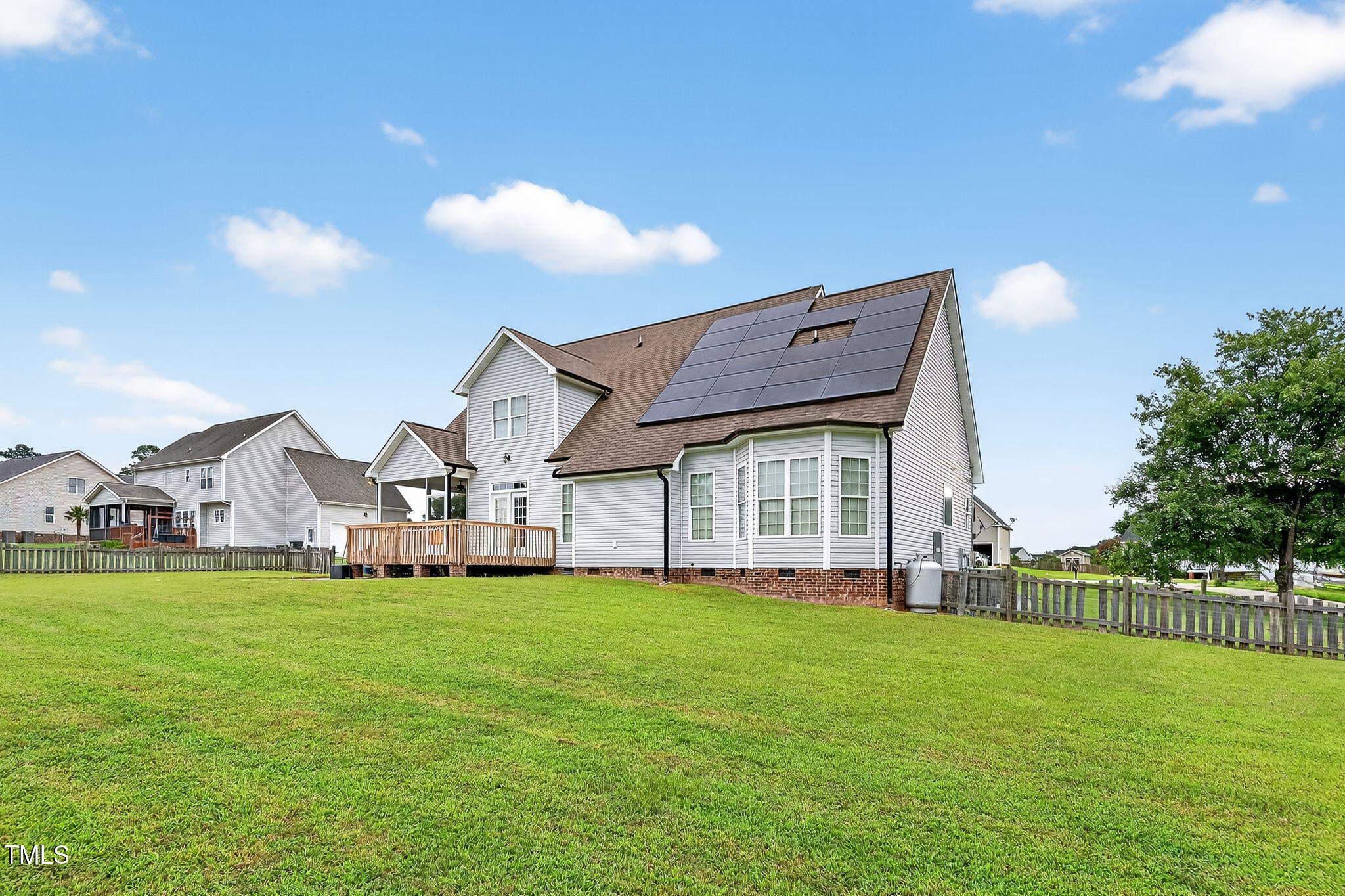 96 Jackson Ridge Court Willow Spring, NC 27592 - Photo 5 of 54 a view of a house with a big yard and large trees
