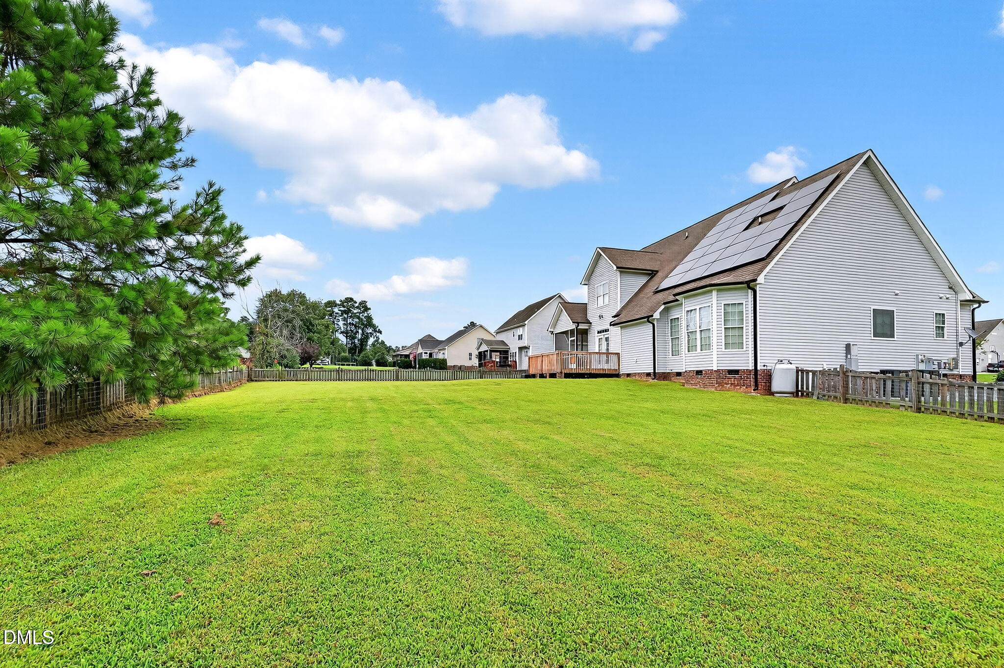 96 Jackson Ridge Court Willow Spring, NC 27592 - Photo 6 of 54 a view of a white house in front of a big yard