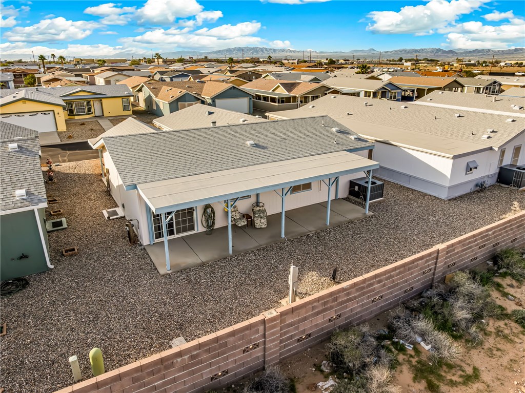 1545 East El Rodeo Road, Unit 166 Fort Mohave, AZ 86426 - Photo 30 of 40 Aerial view of residential area featuring mountains