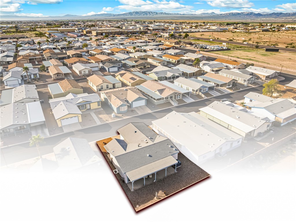 1545 East El Rodeo Road, Unit 166 Fort Mohave, AZ 86426 - Photo 38 of 40 Aerial perspective of suburban area with a mountainous background