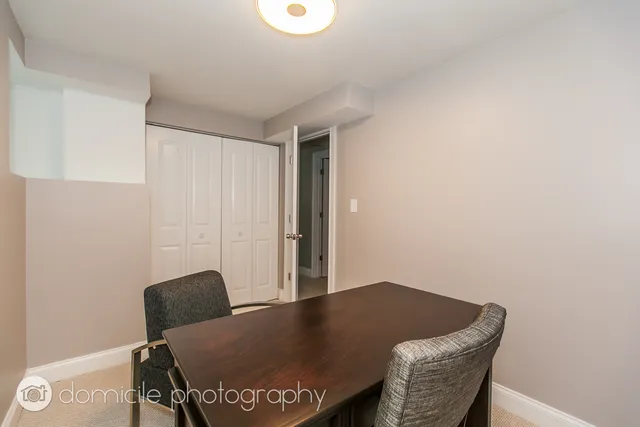 a view of a workspace with furniture