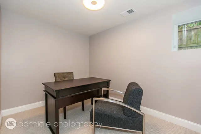 a view of a workspace with furniture