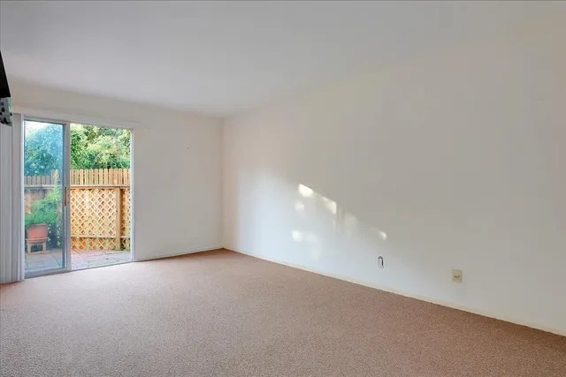 a work room with furniture and a flat screen tv