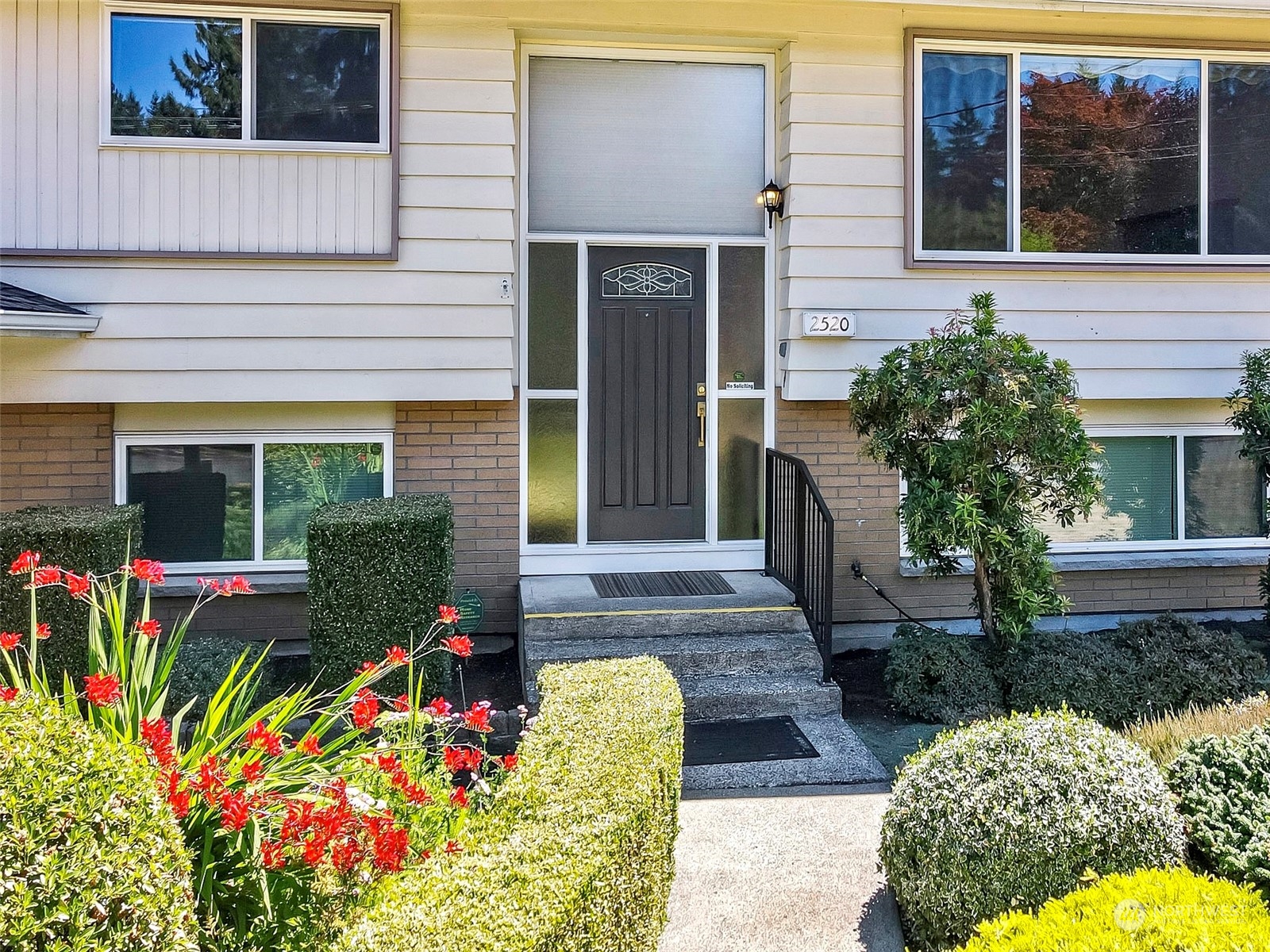 front view of a house with a yard