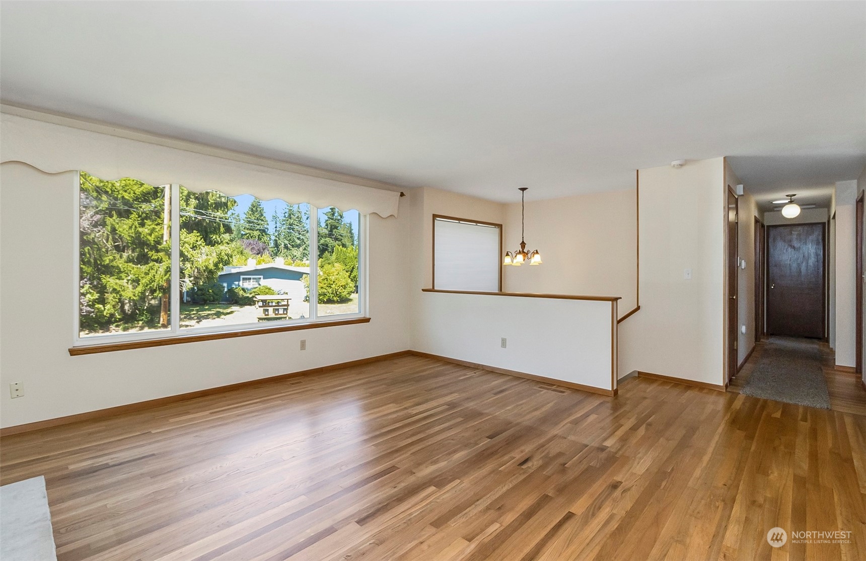 2520 166th Avenue Northeast Bellevue, WA 98008 - Photo 11 of 40 an empty room with wooden floor and windows