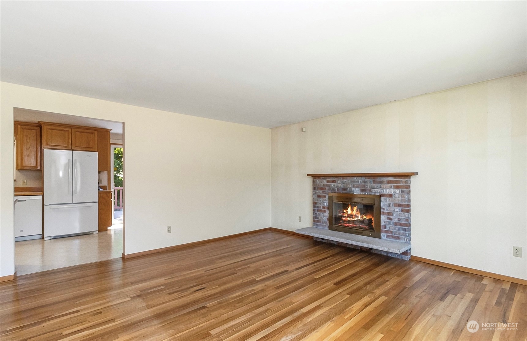 2520 166th Avenue Northeast Bellevue, WA 98008 - Photo 13 of 40 an empty room with wooden floor fire place and windows