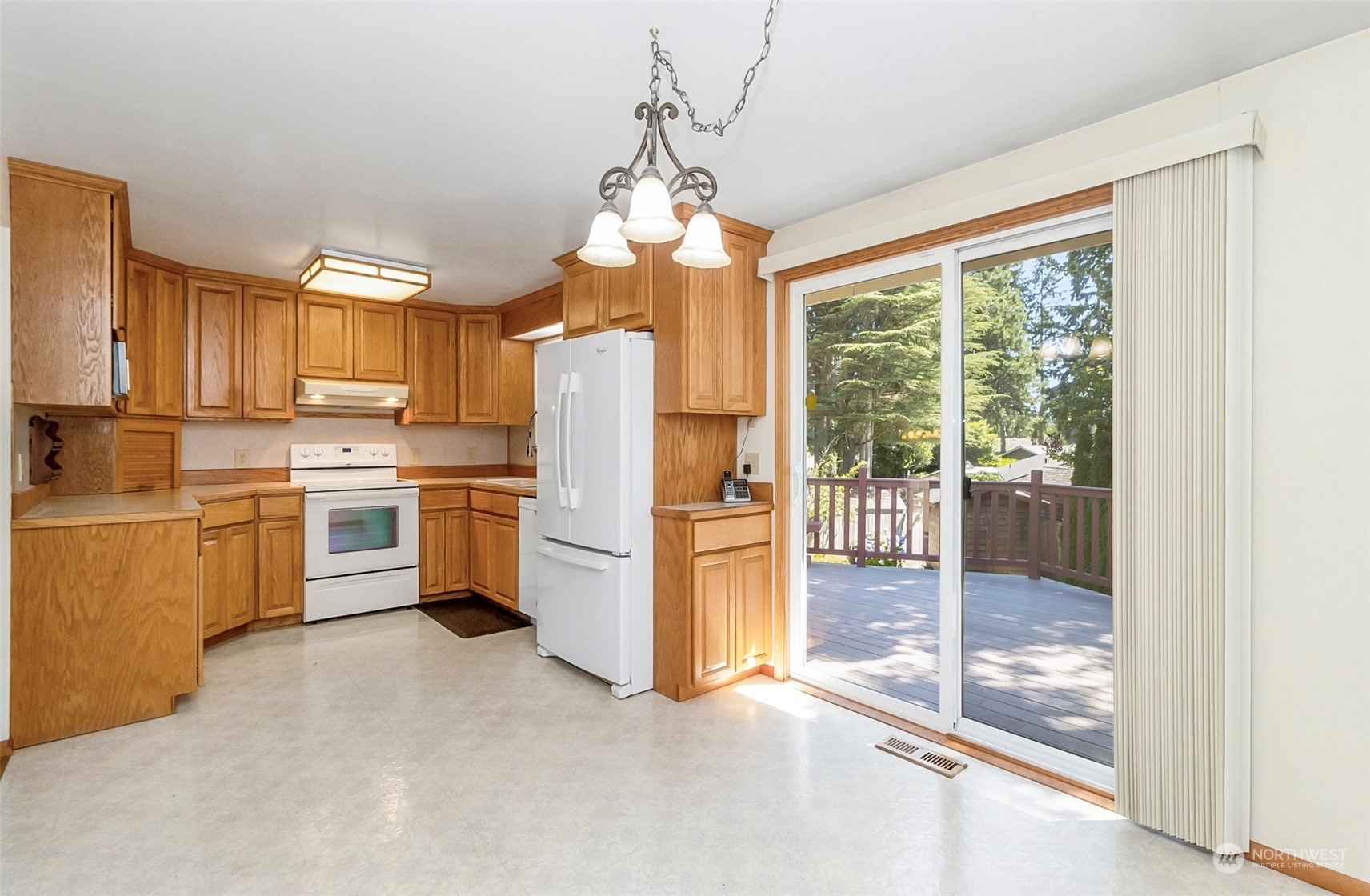 2520 166th Avenue Northeast Bellevue, WA 98008 - Photo 15 of 40 a kitchen with refrigerator a stove and a refrigerator
