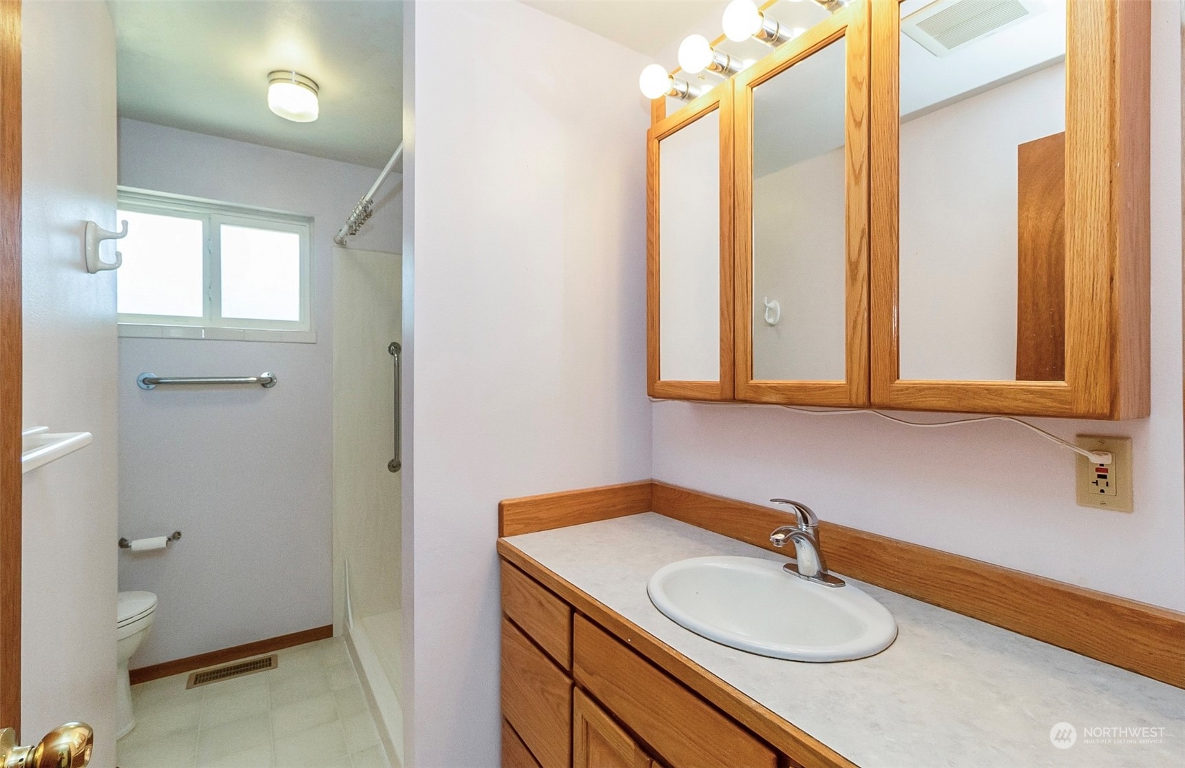 2520 166th Avenue Northeast Bellevue, WA 98008 - Photo 26 of 40 a bathroom with a sink and a mirror