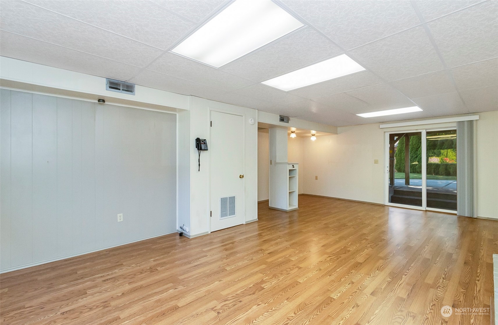 2520 166th Avenue Northeast Bellevue, WA 98008 - Photo 33 of 40 a view of an empty room with wooden floor and a window