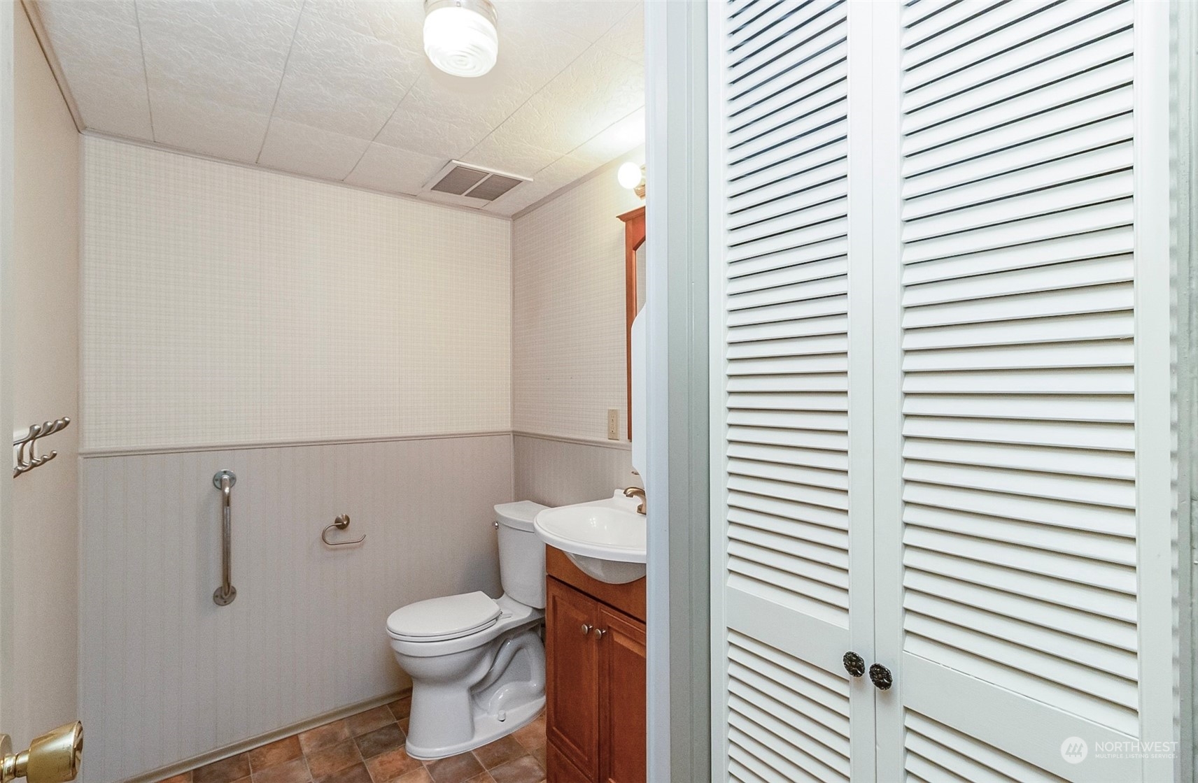 2520 166th Avenue Northeast Bellevue, WA 98008 - Photo 37 of 40 a white toilet sitting next to a white sink