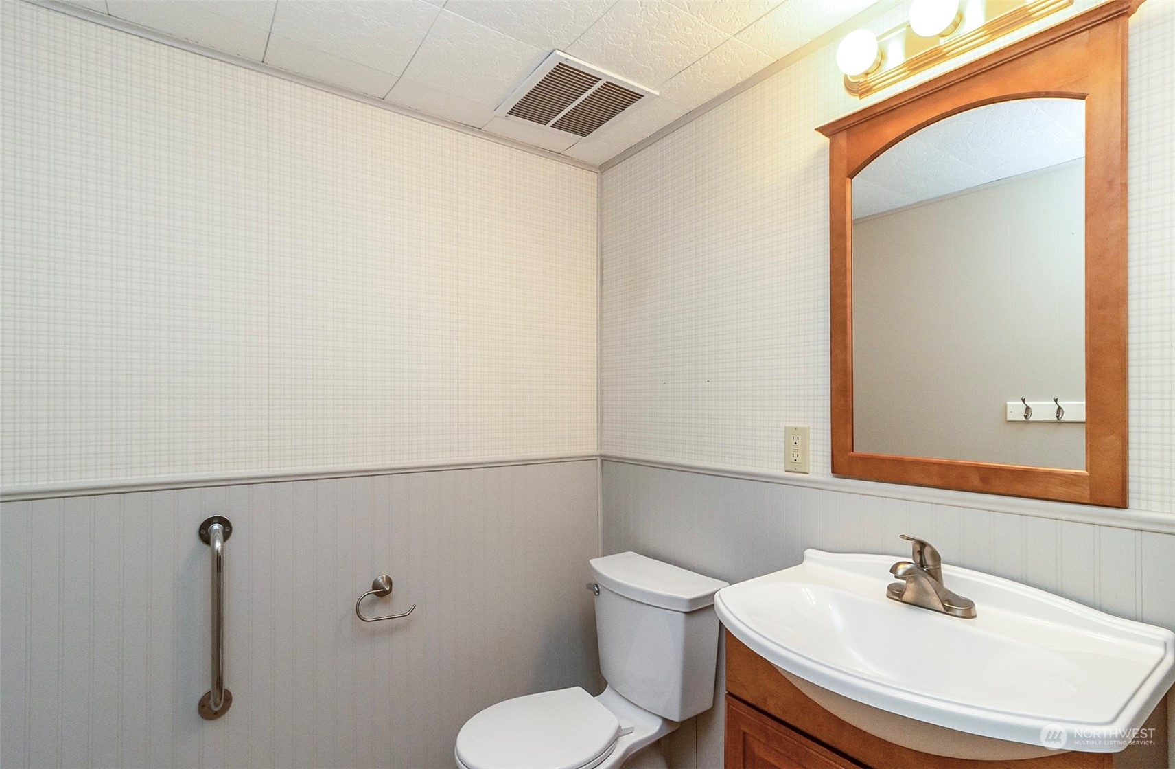 2520 166th Avenue Northeast Bellevue, WA 98008 - Photo 38 of 40 a bathroom with a sink mirror and toilet
