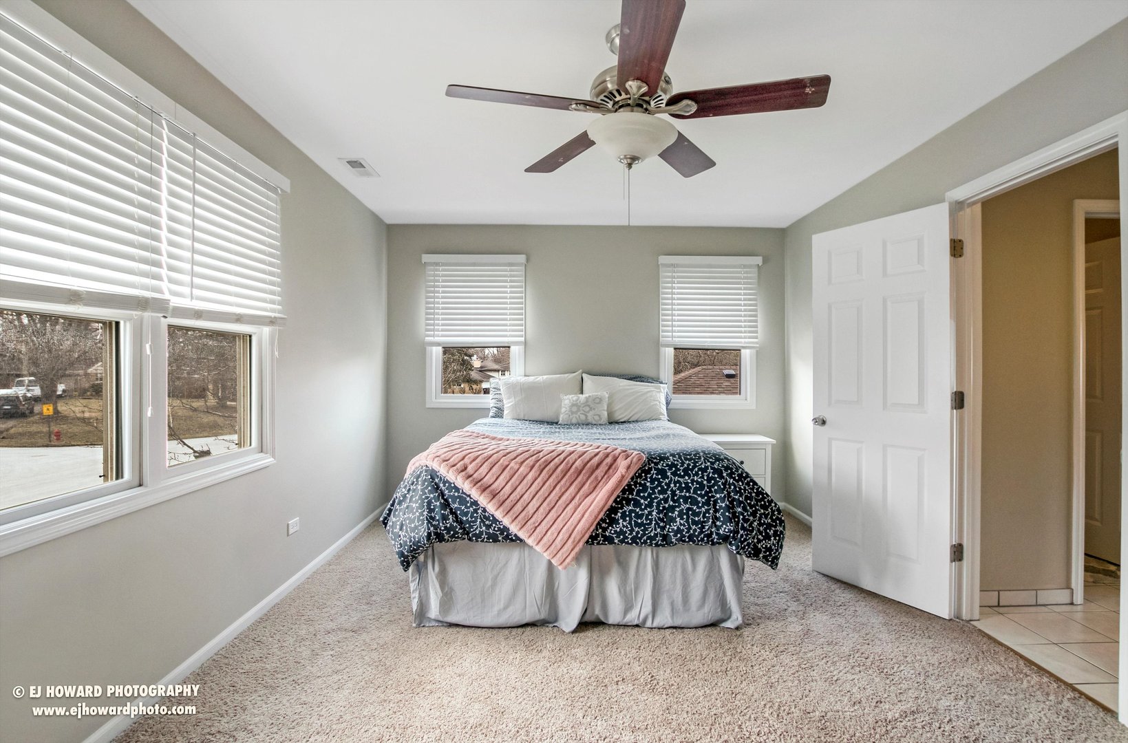 437 Illinois Road Frankfort, IL 60423 - Photo 13 of 35 a bedroom with a large bed and a chandelier