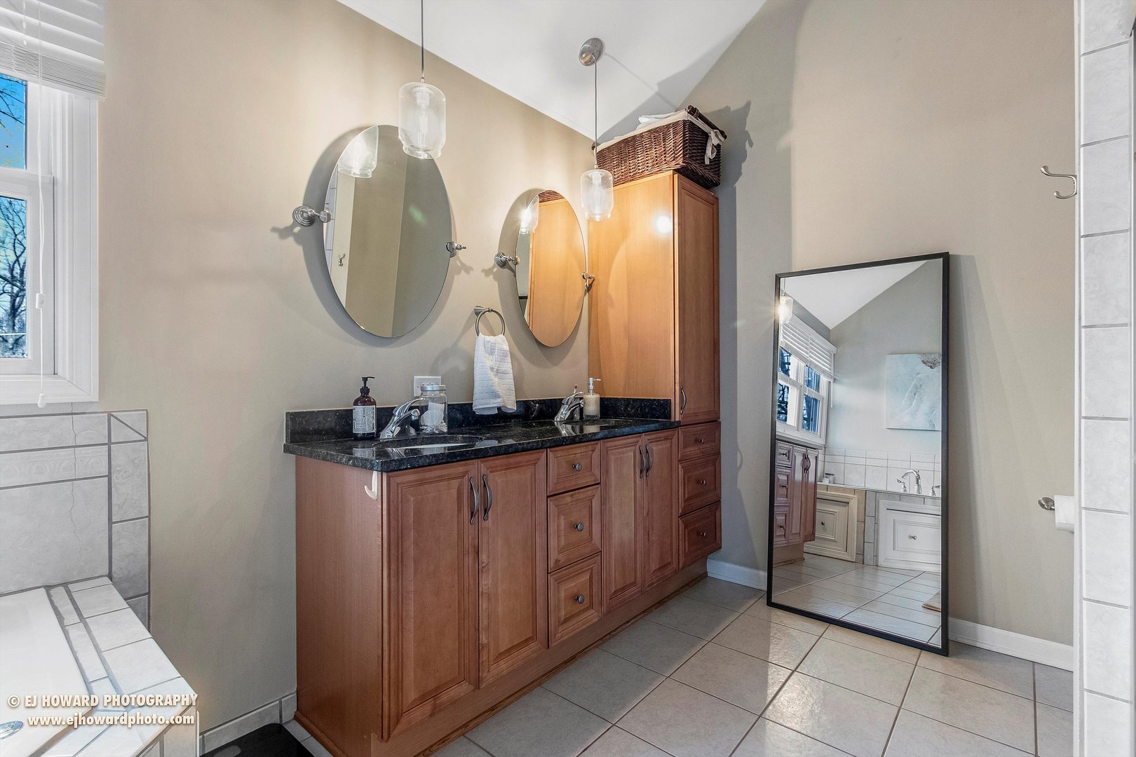 437 Illinois Road Frankfort, IL 60423 - Photo 22 of 35 a bathroom with a granite countertop sink a mirror and a shower