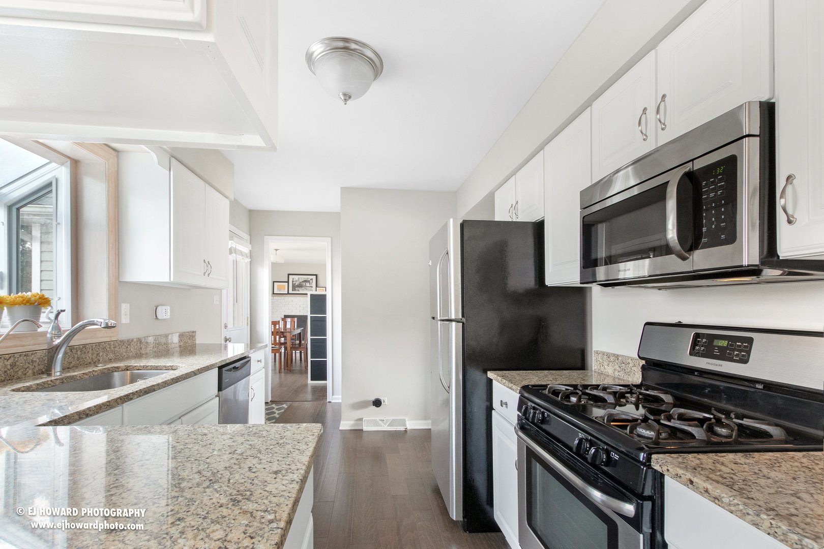 437 Illinois Road Frankfort, IL 60423 - Photo 4 of 35 a kitchen with stainless steel appliances granite countertop a stove a sink and a microwave
