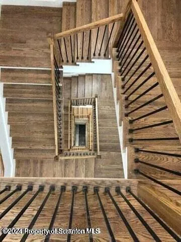 a view of a house with a door and wooden floor