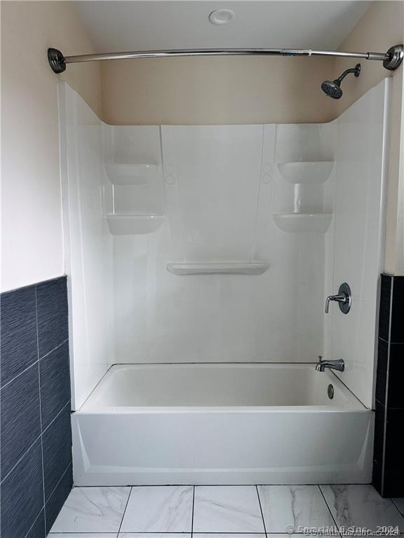 31 Brainerd Road Branford, CT 06405 - Photo 22 of 39 a bathroom with a bathtub and a shower