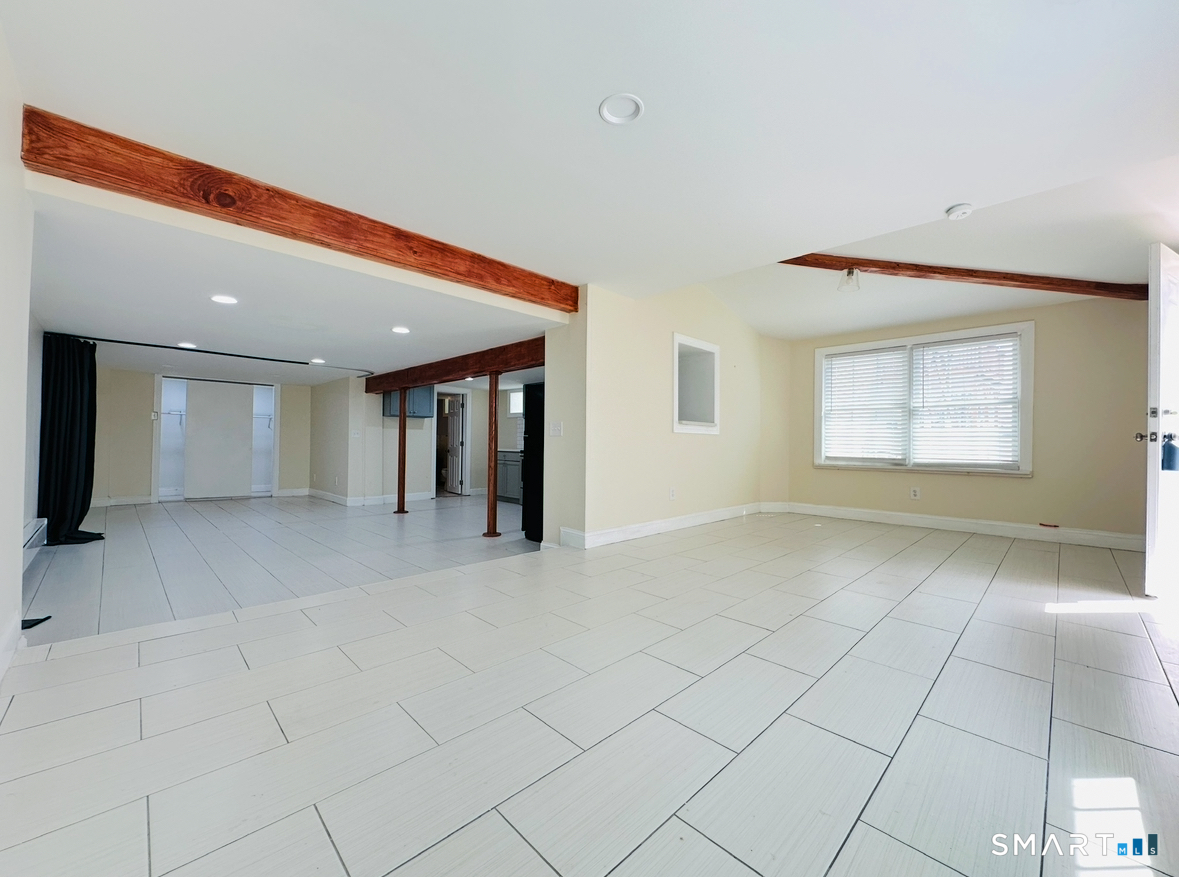 31 Brainerd Road Branford, CT 06405 - Photo 31 of 39 an empty room with entrance and windows