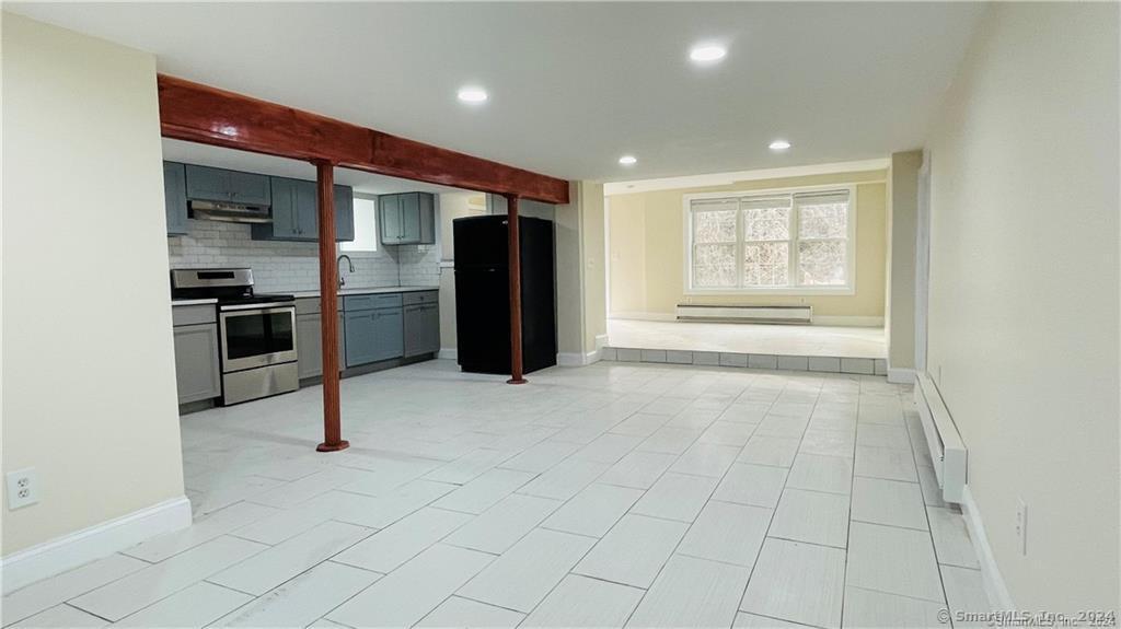 31 Brainerd Road Branford, CT 06405 - Photo 35 of 39 a view of a kitchen with a sink and a refrigerator