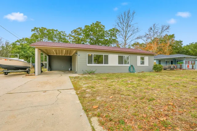 a house with trees in the background