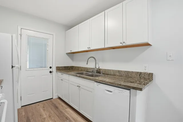 a view of a sink and cabinets