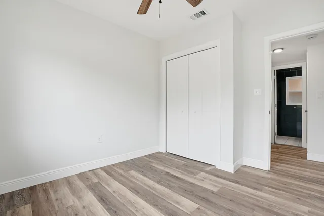 a view of room with window and ceiling fan