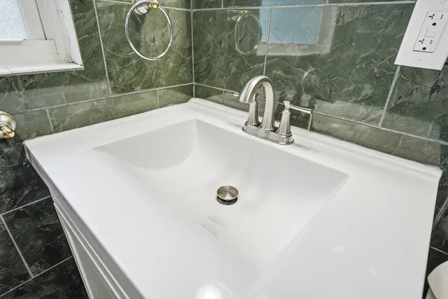 a bathroom with a glass shower door