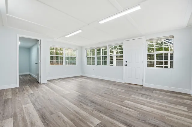a view of a livingroom with furniture and wooden floor